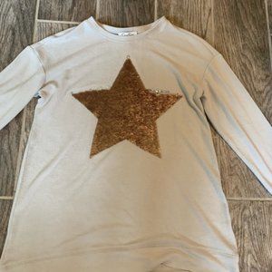 A gray colored long sleeve top